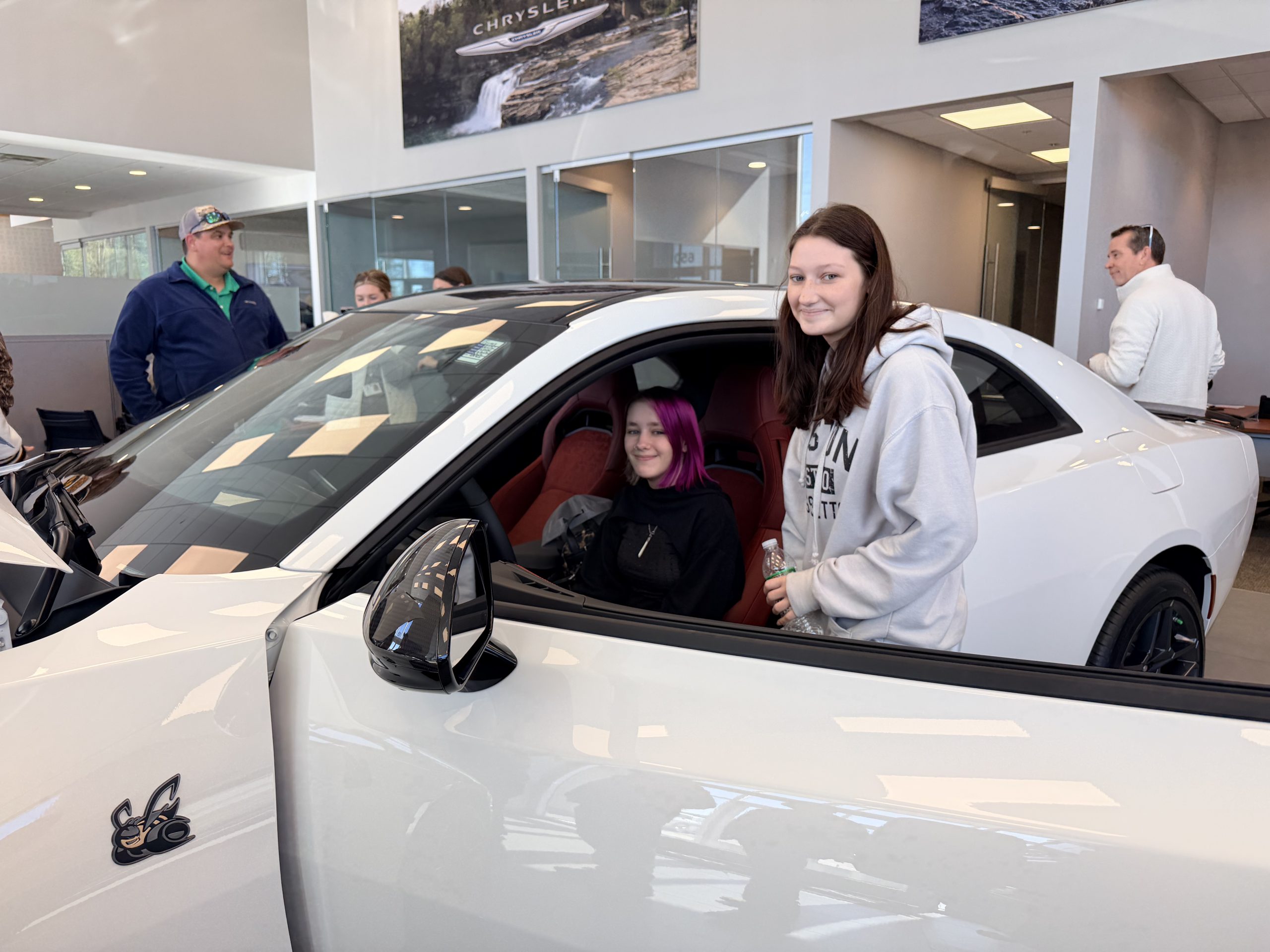 Automotive Career Tech students getting a look at the 2026 Dodge Charger Scat Pack